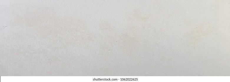 Grungy painted wall texture as background. Cracked concrete vintage floor old white painted. Background washed painting