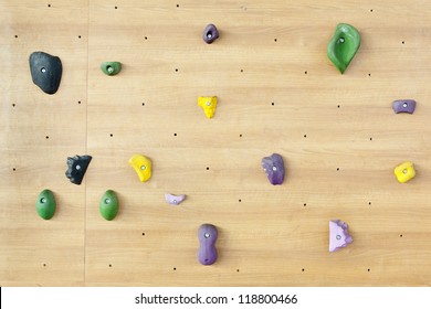 Grungy Surface Of An Artificial Rock Climbing Wall With Toe And Hand Hold Studs.