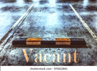 Grungy Vacant Parking Spot With A Blended Overlaid Text