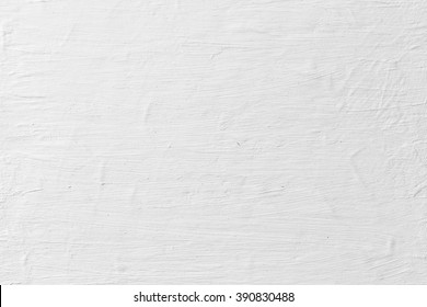 Grungy white concrete wall background. Background from high detailed fragment stone wall.  Cement texture.  Grey concrete wall.