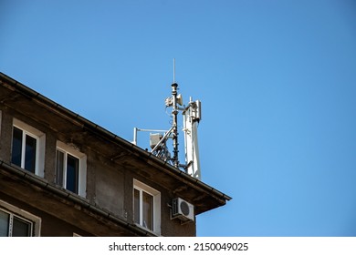 GSM mobile phone antenna tower on house roof