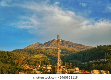 GSM and radio telecommunication tower in mountains. Cell phone tower. Base transceiver station. Wireless communication antenna transmitter - Powered by Shutterstock