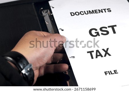 Gst filing documents concept heading page. Taxation documents and records in a folder.