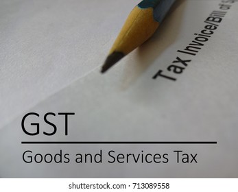 GST Or Goods And Services Tax Represented With A Pencil And A Tax Invoice