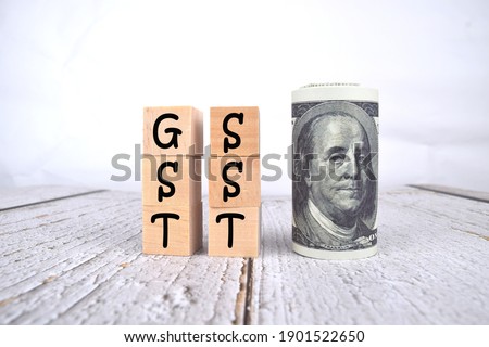 GST SST wording with selective focus of bank note isolated on white background. Business and economy concept.