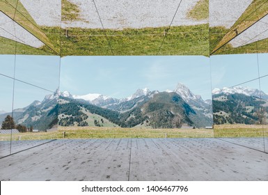 GSTAAD - MAY 23, 2019: The Swiss Alps Reflected On Mirage Gstaad By Doug Aitken