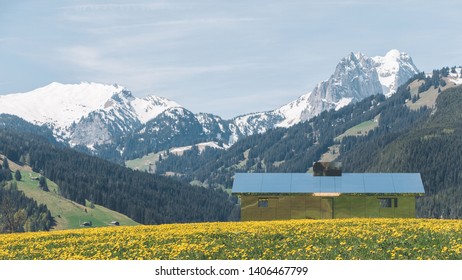 GSTAAD - MAY 23, 2019: The Swiss Alps Reflected On Mirage Gstaad By Doug Aitken