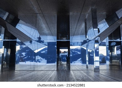 Gstaad, Switzerland - December 18, 2020: The Swiss Alps Winter Landscape Reflected In The Interior Of Mirage Gstaad By Doug Aitken