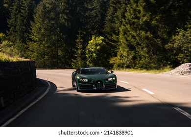 Gstaad, Switzerland - September 2020: Bugatti Chiron Sport Green French Hypercar Driving On Road In Woods Of Gstaad During Supercar Owners Circle Annual Meeting
