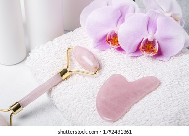 Gua Sha Massager And Face Roller On Stone Background. Massage Tool For Facial Skin Care, SPA Beauty Treatment Concept - Image