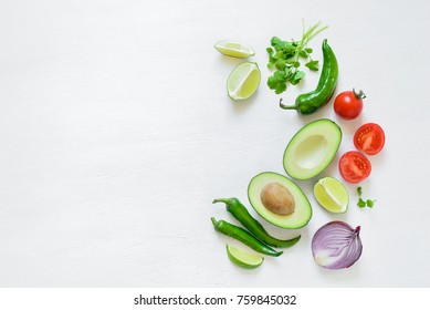 Guacamole cooking ingredients concept background with a space for a text, flat lay arrangement, overhead view - Powered by Shutterstock