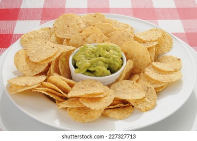 Guacamole With Round Corn Tortilla Chips On A Picnic Table