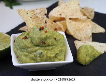 Guacamole And White Corn Chips. Close Up. 