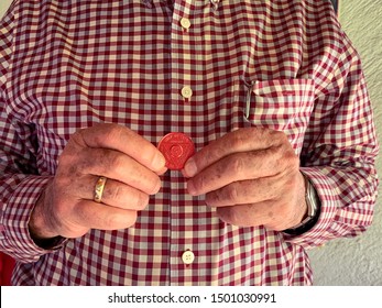 Guadalajara, Jalisco - September 10 2019: Senior  Proudly Holds AA Alcoholics Anonymous 8 Month Sobriety Chip In Her Hand, Awarded For Abstaining From Alcohol Or Other Substances. Addiction Recovery 