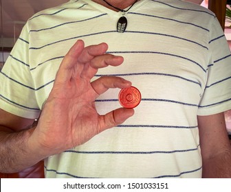 Guadalajara, Jalisco - September 10 2019: Young Male Proudly Holds AA Alcoholics Anonymous 8 Month Sobriety Chip, Awarded For Abstaining From Alcohol Or Other Substances. Addiction Recover 