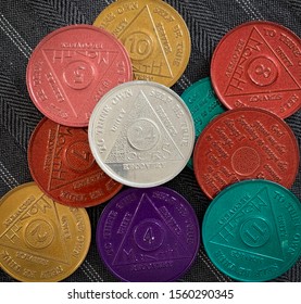 Guadalajara, Mexico - November 14 2019: Colorful 12 Step Program Sobriety Chips With Different Numbers Representing Months Of Sobriety Or Abstinence From Alcohol, Narcotics, Or Other Substances