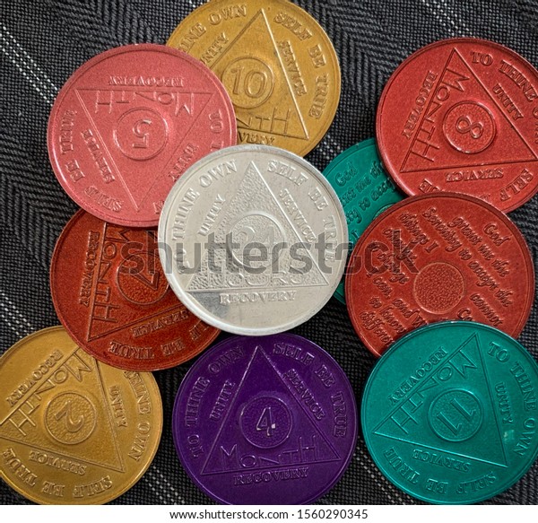 Guadalajara, Mexico - November 14 2019:\
Colorful 12 step program sobriety chips with different numbers\
representing months of sobriety or abstinence from alcohol,\
narcotics, or other\
substances