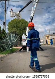 Guadalajara, Mexico - October 22 2019: CFE Male Electrical Company Workers In Uniform Attend To An Electrical Post Fire Incident. Outdoors Street Accident Scene. Blue Collar Workers 