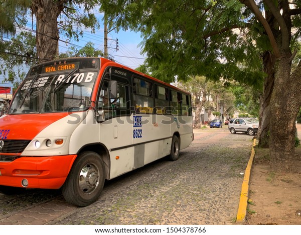 Guadalajara, Mexico - September 13 2019: Public\
transport bus ruta  R-170-B going on Av. Aurelio Ortega, Zapopan,\
Mexico. Urban bus, nearly empty\
