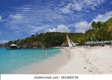 GUADALOUPE - MARCH 2018: View Of The Palms, Turquoise Sea Water And White Sand Beach Of La Caravelle In Guadeloupe Island, Caribbean