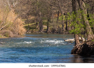 Guadalupe River Flowing Through Park With Trees On Banks In New Braunfels Texas