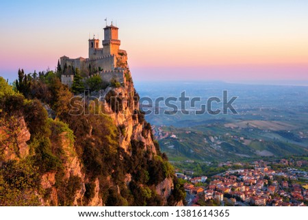 Guaita, the First of the Three Towers of San Marino, on the top of Mount Titano rock in sunrise light, Republic of San Marino. Guaita is UNESCO World Culture Heritage site.