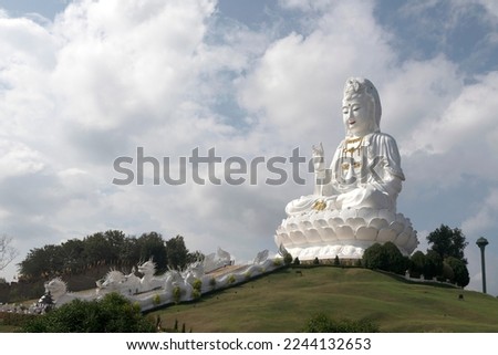 Guan yin statue on the peak hill at the temple in Thailand Statue of Guan Yin is the Goddess of Mercy and Compassion in the Buddhist religion. symbol of Mahayana Buddhism in Asian and East Asia.