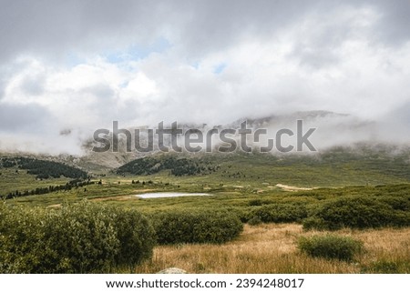 Guanella pass, mountain pass in Colorado. Fog and clouds over mount Bierstadt on rainy fall day. Mount Bierstadt trailhead, Bierstadt Lake