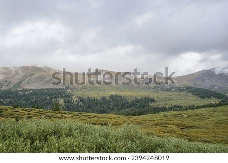 Guanella pass, mountain pass in Colorado. Fog and clouds over mount Bierstadt on rainy fall day. Mount Bierstadt trailhead