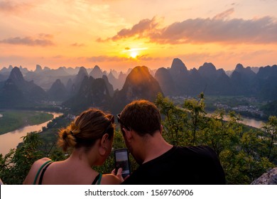 GUANGXI,CHINA 14 may 2019 - tourist watching sunset landscape of Laozhai mountain,located in Xingping,Yangshuo,Guilin