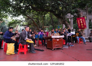 Guangzhou, China - 28th December 2018 : One Full Traditional Chinese Orchestra Performing In Front Of Yue Xiu Park Near Beixiu Lake.