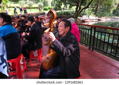 Guangzhou, China - 28th December 2018 : One Full Traditional Chinese Orchestra Performing In Front Of Yue Xiu Park Near Beixiu Lake.