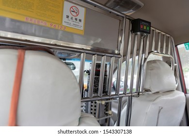 GUANGZHOU ,CHINA - APRIL 30, 2018: Asian Taxi Cab Interior With Chrome Rail Bars For Drivers Safety.