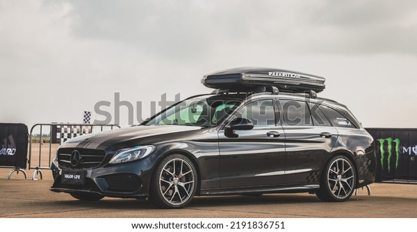 Guangzhou, China- August 16,2022: A black\
Mercedes-Benz SUV is parked in\
courtyard