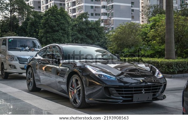 Guangzhou, China- August 16,2022: A black\
Ferrari GT4 LUSSO hypercar is parked in\
street