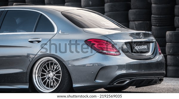 Guangzhou, China- August 16,2022: a grey\
Mercedes-Benz C-Klass sedan is parked in\
courtyard