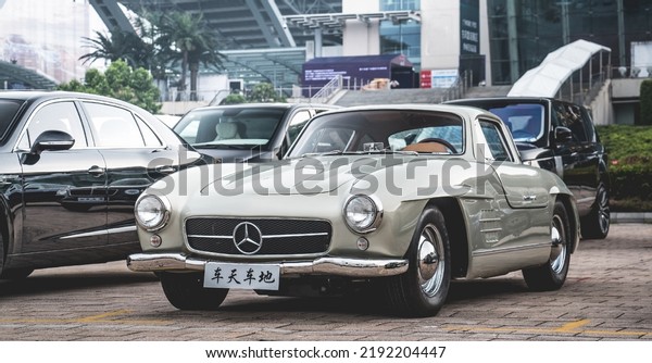 Guangzhou, China- August 16,2022: A silver\
Mercedes-Benz 300SL coupe is parked in\
courtyard