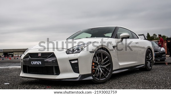 Guangzhou, China- August 16,2022: A white\
Nissan GT-R sportcar is parked in\
courtyard