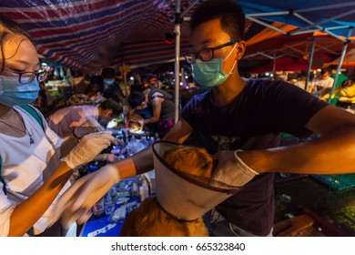 GUANGZHOU, CHINA - JUNE 22. 2017 - Volunteer Veterinarians Treat Sick And Wounded Dogs Rescued From A Truck Heading Towards The Yulin Dog Meat Festival In The Improvised Shelter.