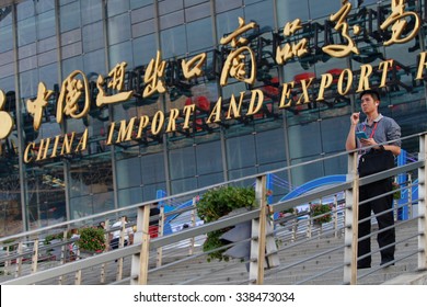 GUANGZHOU, CHINA - OCT 17. 2015:A Man Talks On His Phone In Front Of China Import And Export Fair Also Known As Canton Fair. The Canton Fair Is The Largest Trade Fair In China.