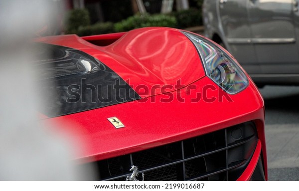 Guangzhou, China- September 1,2022: A  red Ferrari\
hypercar is parked in\
street