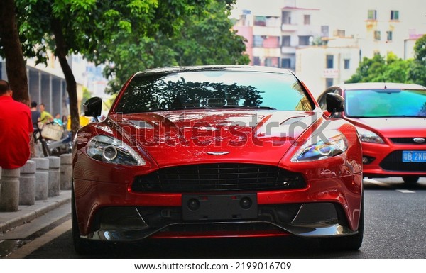 Guangzhou, China- September 1,2022: A red Aston\
Martin hypercar is parked in\
street