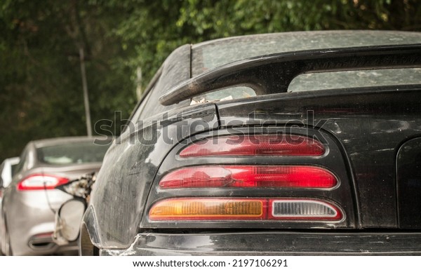 Guangzhou, China- September 1,2022: The taillights\
of A black Ford Mustang\
coupe