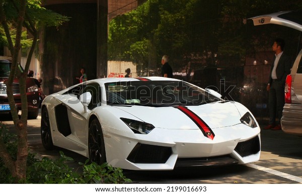 Guangzhou, China- September 1,2022: A white\
Lamborghini hypercar is parked in \
street