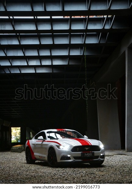 Guangzhou, China- September 1,2022: A white\
Ford Mustang sportcar is parked in\
courtyard