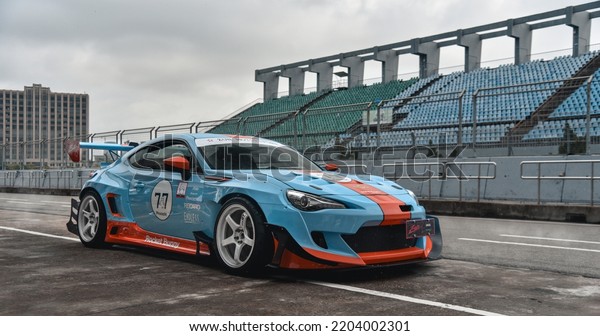 Guangzhou, China- September\
18,2022: A blue TOYOTA 86 Rocket Bunny v3 JUN V8 sportcar is parked\
on road