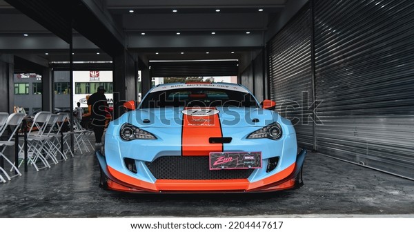 Guangzhou, China- September\
18,2022: A blue TOYOTA 86 Rocket Bunny v3 JUN V8 sportcar is parked\
in garage