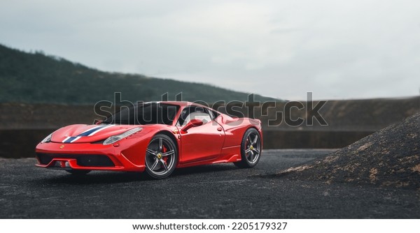 Guangzhou, China- September\
18,2022: A red Ferrari 458 SPECIALE hypercar is parked on mountain\
road