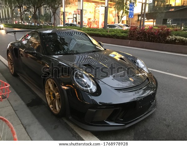 Guangzhou, China. Year 2019: view of\
Porsche 911 GT3 RS parked in the street. German\
supercar.