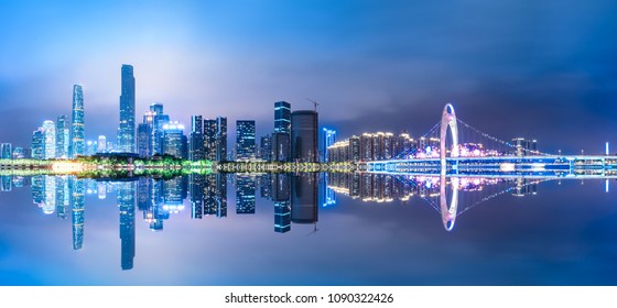 Guangzhou,China modern city skyline panorama on the zhujiang river at night  - Powered by Shutterstock